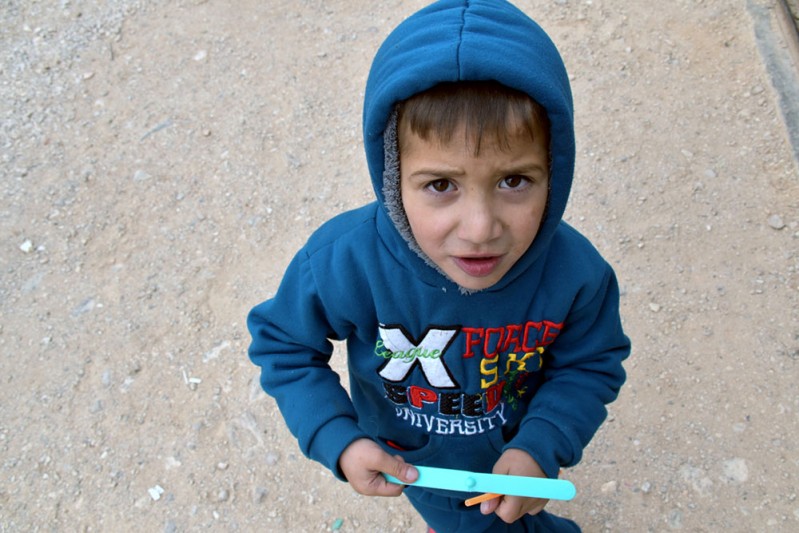 3. Elias, 5, plays outside the family home_min