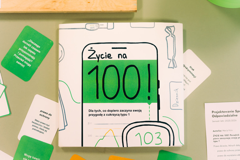 Książka-poradnik z ilustracjami o cukrzycy typu 1 oraz zestaw kart edukacyjnych.