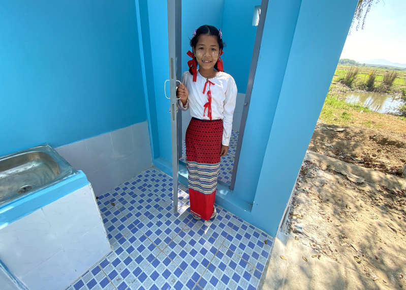 Student girl infornt of latrine Photo by Han Wunna Htun.JPG